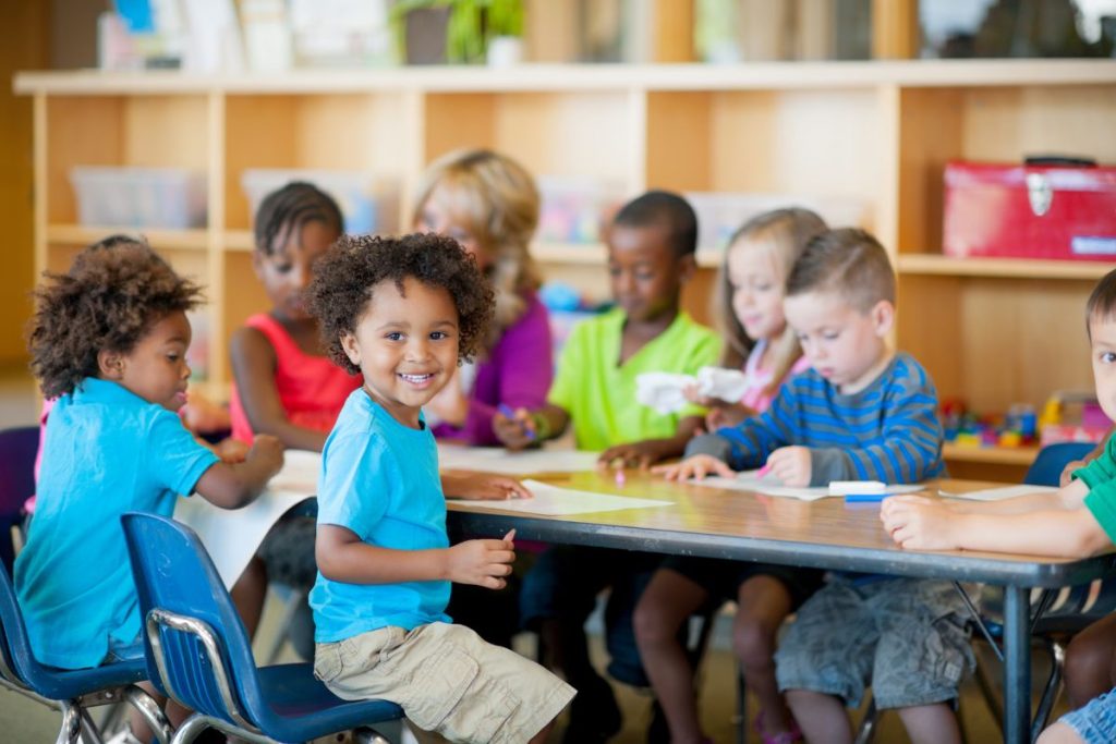 children working in a Montessori classroom environment